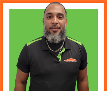 Frank, SERVPRO employee, cut out and set against a green backdrop