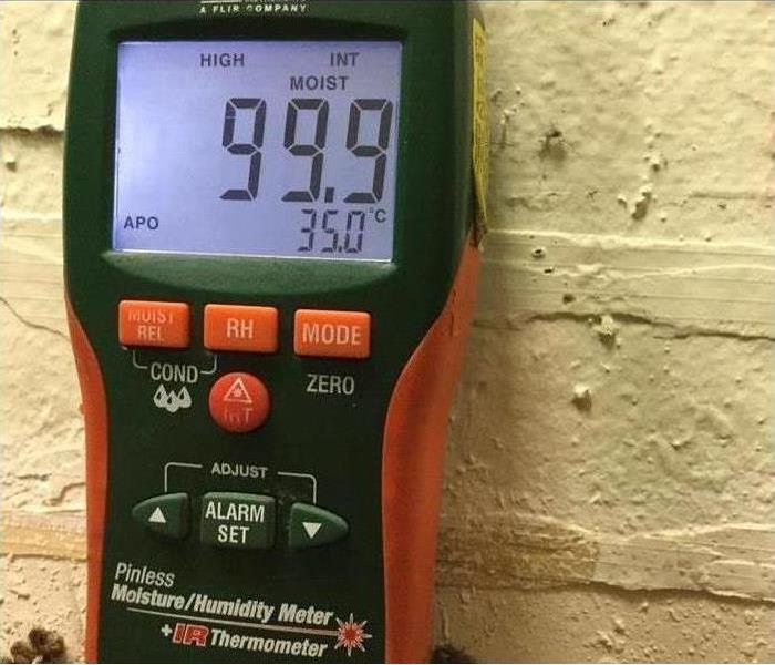 SERVPRO using a moisture meter