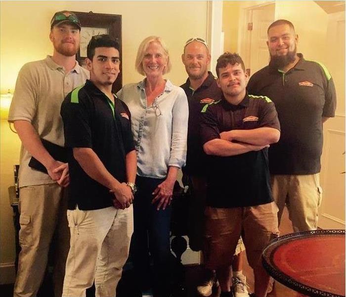 SERVPRO employees with clients
